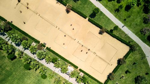 an overhead view of a tennis court with trees at Tui Magic Life Jacaranda in Side