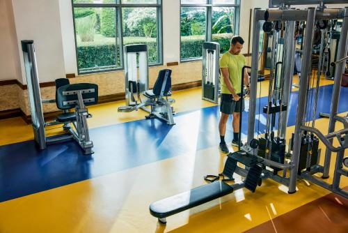 a man standing in a gym with treadles at Tui Magic Life Jacaranda in Side