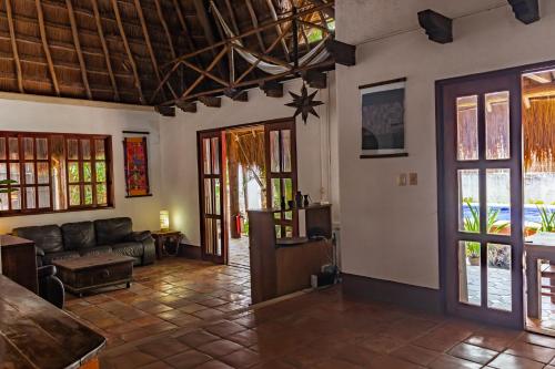 a living room with a couch and a table at Casaejido in Playa del Carmen