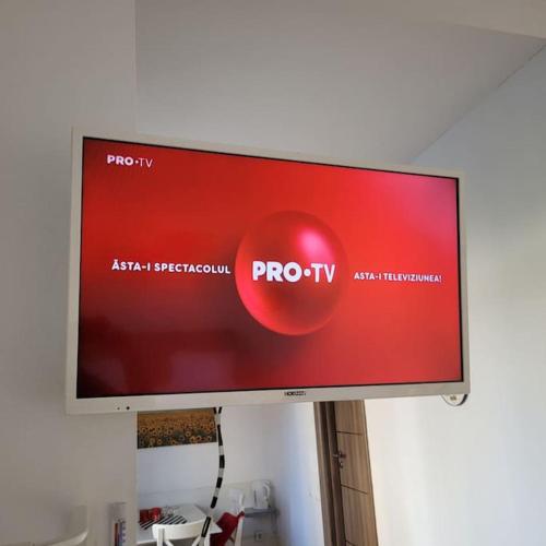 a flat screen tv hanging on a wall at Anastasia 1 Balcescu apartment in Bucharest