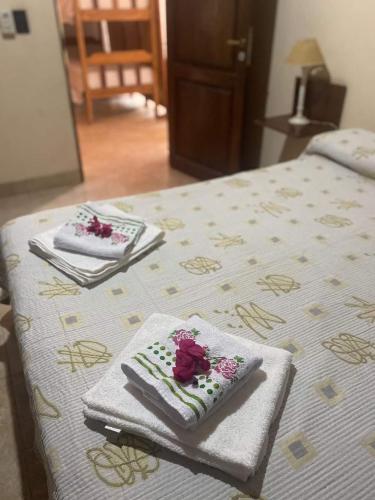 a bed with towels and napkins on top of it at Lo de Mora in Cafayate