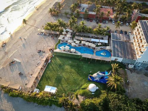 an aerial view of a resort next to a beach at Mishol Bodas Hotel & Beach Club Acapulco Diamante in Acapulco