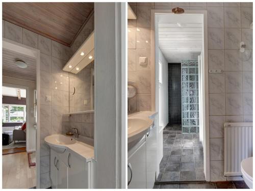 a bathroom with a tub and a sink and a mirror at Peaceful getaway in the woods w/ fireplace in Åsljunga
