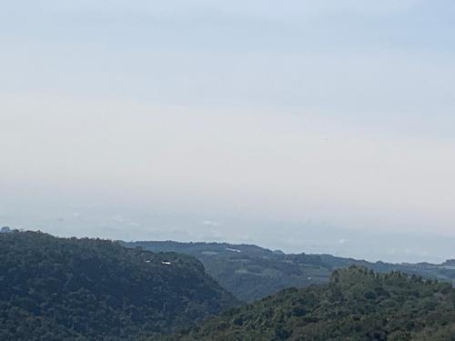 a view of a mountain with trees in the distance at Apartamento Aconchegante e Silencioso em Bairro Tranquilo in Bento Gonçalves