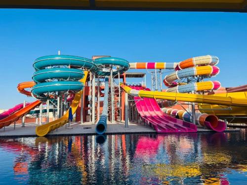 a water park with a bunch of water slides at شاليه بورتو شرم الشيخ in Sharm El Sheikh