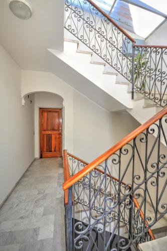 a staircase with a skylight in a house at Ca' Muna - Sea View Penthouse, Private Rooftop, Walking to the Beach in Rapallo