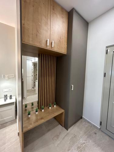 a bathroom with a counter with plants on it at Armonía Small Luxury Apartments in Ierápetra