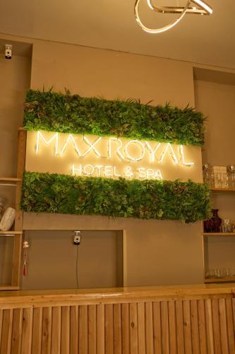 a sign for a moroccan hotel and spa at Max Royal in Almaty