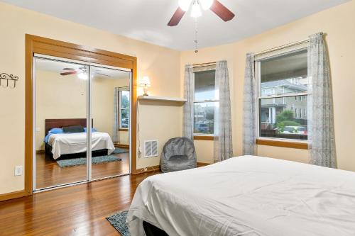 a bedroom with a bed and a mirror and a bed at Bedroom near Yale Hospital/Bridgeport in Bridgeport
