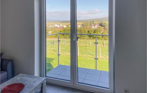 a window with a view of a green field at Lovely Apartment In Bad Salzungen With Kitchen in Bad Salzungen