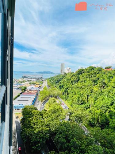 a view of a city with trees and a road at Maison life 小居屋 Jesselton Quay CityPads in Kota Kinabalu