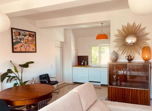a living room with a couch and a table at Superb Surf House Next to best Caparica Beach in Costa da Caparica