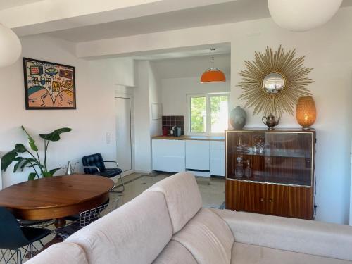 a living room with a couch and a table at Superb Surf House Next to best Caparica Beach in Costa da Caparica