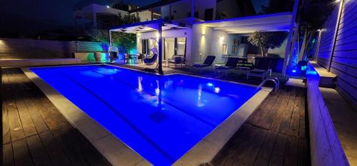 a swimming pool with blue lighting in a house at וילה סאן אילת in Eilat