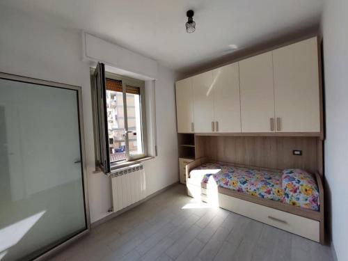 a bedroom with a bed and a large mirror at Casamia in Follonica