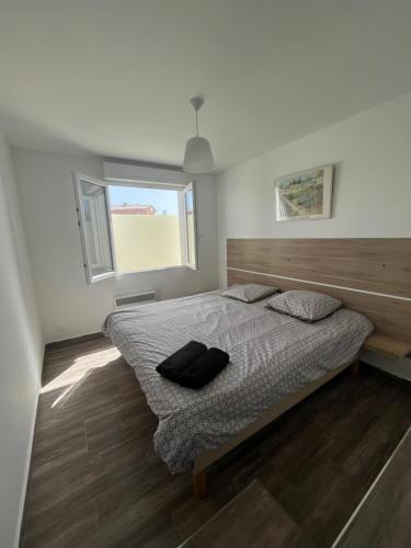 Säng eller sängar i ett rum på Appartement (3), 4 personnes Aéroport Marseille