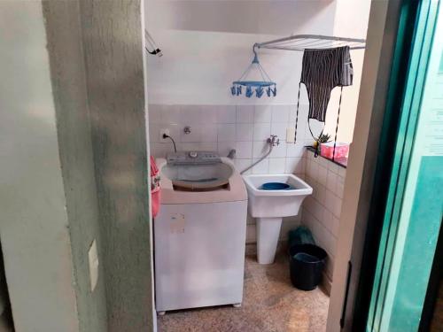 a small bathroom with a sink and a toilet at Casa de Campo com Wi-Fi churrasq e piscina em MG in Lagoa Santa