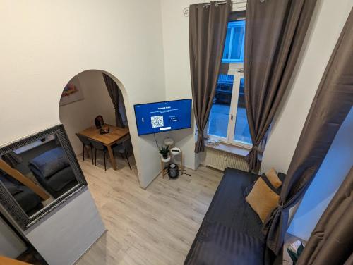 Телевизор и/или развлекательный центр в Schönes Apartment am Rhein - Zentral 1