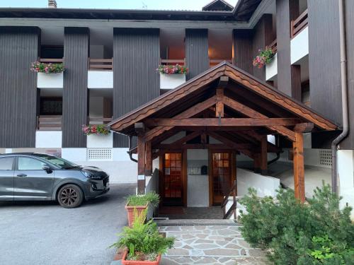 a car parked in front of a building at Charming studio on the slopes - Apartment Oliver Folgarida in Folgarida