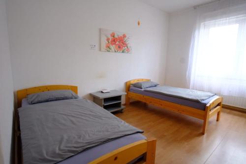 En eller flere senge i et værelse på Ferienwohnung Bauknecht, Pforzheim