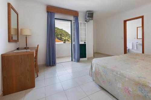 Ένα ή περισσότερα κρεβάτια σε δωμάτιο στο Hotel Solmar