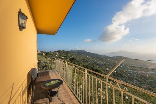 a balcony with a chair and a view at Al Calar del Sole in Massa Lubrense