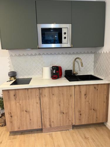 Una cocina o cocineta en Charmant studio