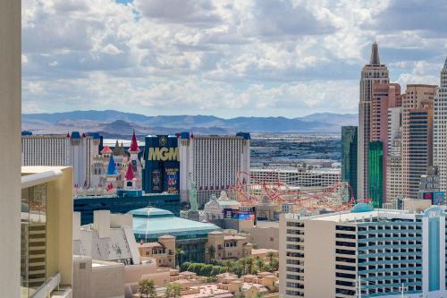a view of a city with tall buildings at Premium Suite MGM Signature HIGH FLR Balcony Strip View in Las Vegas