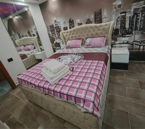 a bedroom with a large bed in a store at Hedonic Wellness Apartmani in Niš