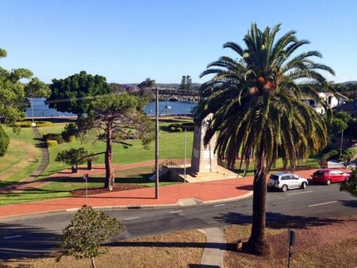 a palm tree on the side of a street at Home Plus TAREE CBD in Taree