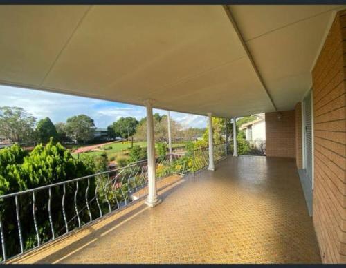 an empty balcony of a house with a view at Home Plus TAREE CBD in Taree