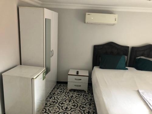 Reydel Hotel tesisinde bir odada yatak veya yataklar