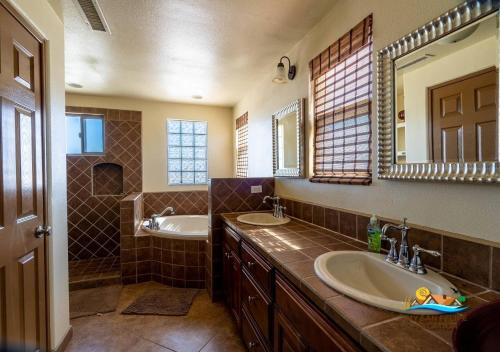 a bathroom with two sinks and a mirror at Casa Talebi El Dorado Ranch San Felipe WiFi in San Felipe