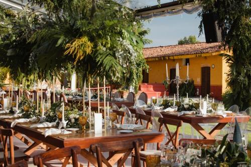 a table set up for a dinner party in a courtyard at Hacienda El Carmen Hotel & Spa in Portes Gil