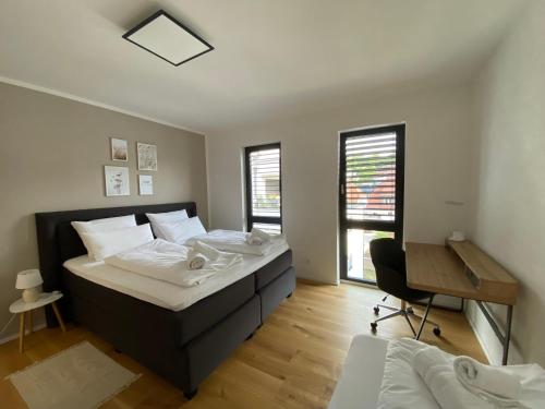 Postelja oz. postelje v sobi nastanitve KEEP Hosting M11 Apartments am Kocher mit Balkon, Küche und Parkplatz