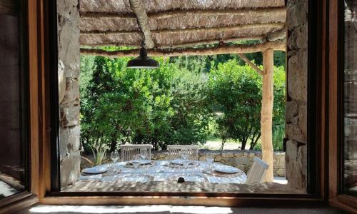 a view of a patio from a window at Les Bergeries de Piazzagina in Piediquarciu