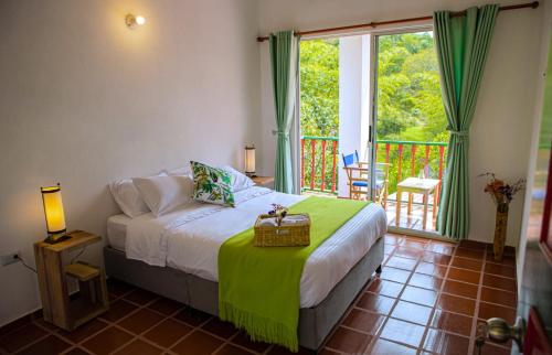 Postel nebo postele na pokoji v ubytování Ecohotel Monteverde