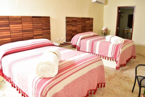 Postel nebo postele na pokoji v ubytování Hotel Campestre Santa Clara