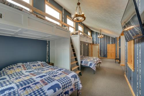 a bedroom with two beds and a loft bed at Spacious Old Forge Condo w/ Patio & Fire Pit! in Old Forge
