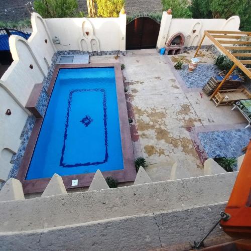 a swimming pool in the middle of a yard at Mystical habou domes villa private pool in Luxor