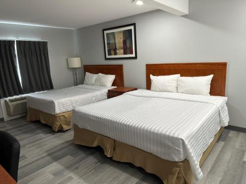 Ένα ή περισσότερα κρεβάτια σε δωμάτιο στο RAMSHORN MOTEL