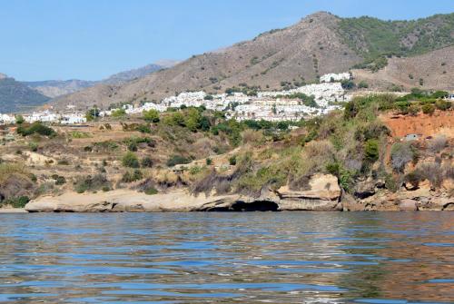 a view of a town from the water at Apartamentos StarNerja II in Nerja