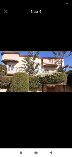a picture of a building with bushes in front of it at Villa Sousse in Agadir