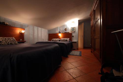 Posteľ alebo postele v izbe v ubytovaní B&B Torre in Langa