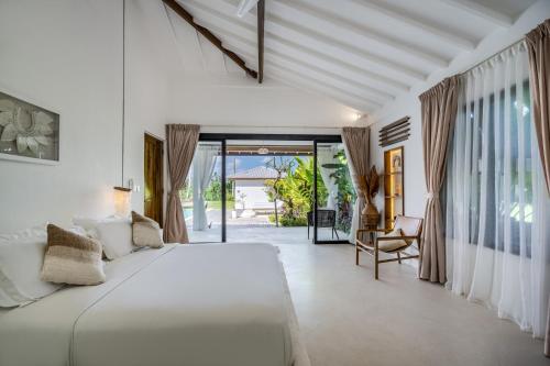 Ένα ή περισσότερα κρεβάτια σε δωμάτιο στο Villa Bisous Ubud