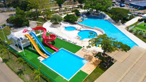 an overhead view of a pool with a water park at Sosua Ocean Village in Sosúa