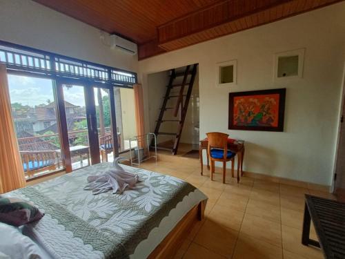 Postel nebo postele na pokoji v ubytování wahyu accomodation
