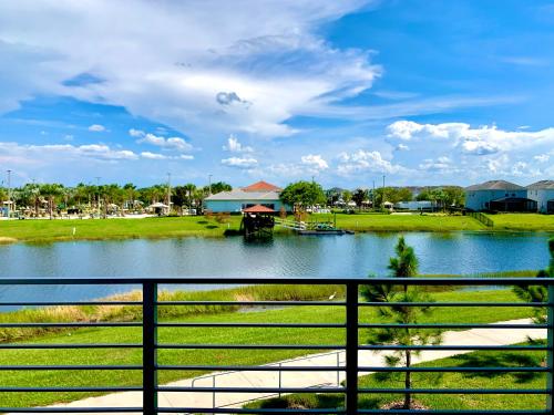 a view of a river with a boat in it at 3B2B-Beautiful Lake View-Baby Friendly-FREE WATER PARK!NO Resort Fee-5 Miles to Disney-Storey Lake 3141 in Kissimmee