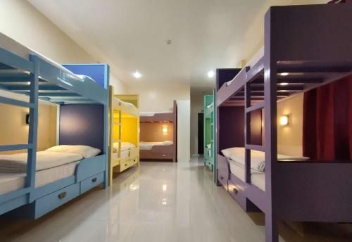 a room with multiple bunk beds in it at Sea Horizon Resort in Zamboanguita