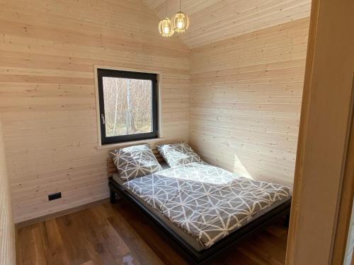 Ліжко або ліжка в номері Holiday cottages, Wicie